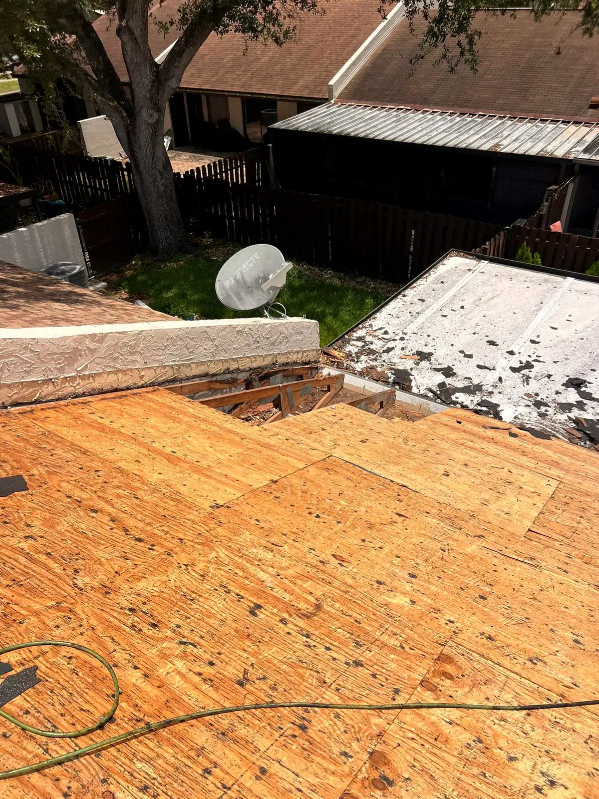 New plywood sheathing fastened on a roof deck